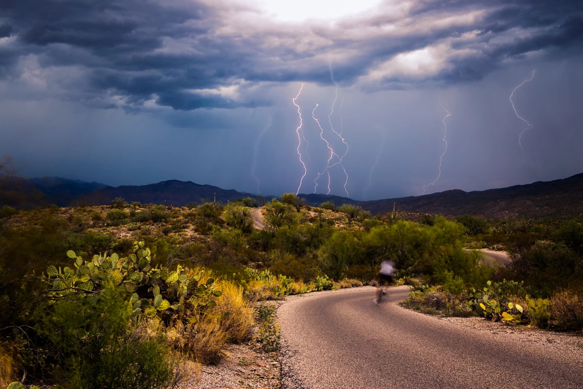 Lightning strikes on a desert landscape during a thunderstorm